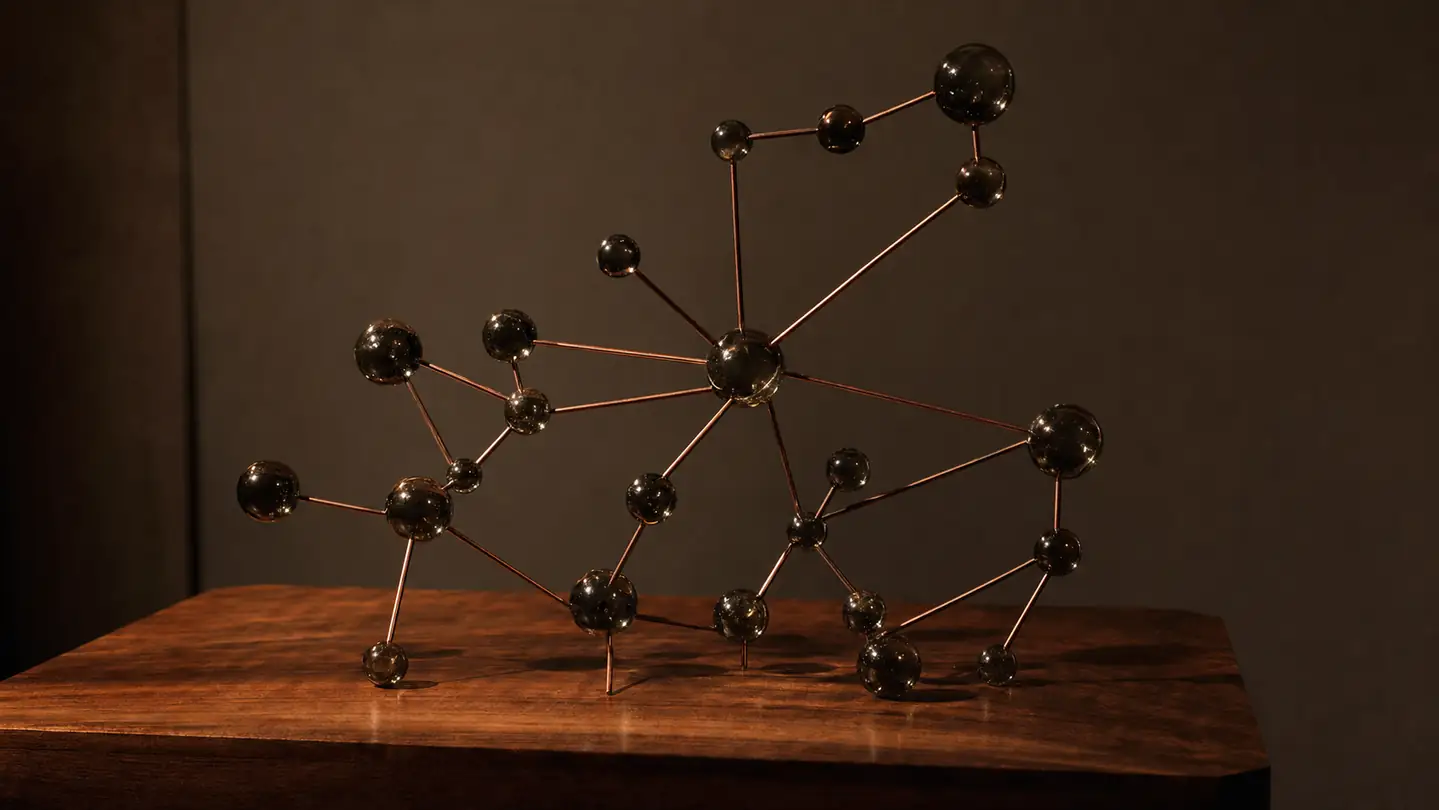 Glass and copper sculpture of connected nodes, a physical stand-in for an on-device knowledge graph